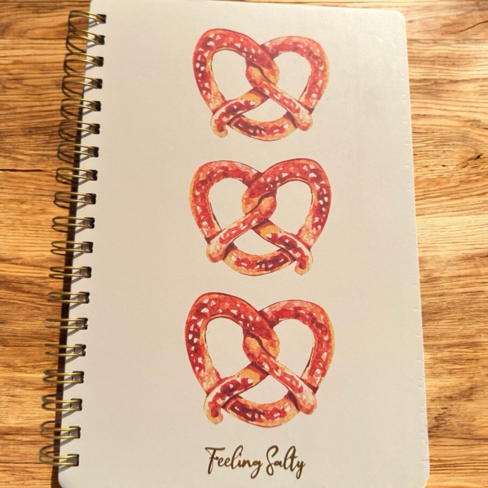 Cream pretzels 🥨 Spiral Notebook with Whimsical Design “feeling salty”